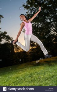 black-girl-jumping-and-having-fun-outside-J1JECM.jpg